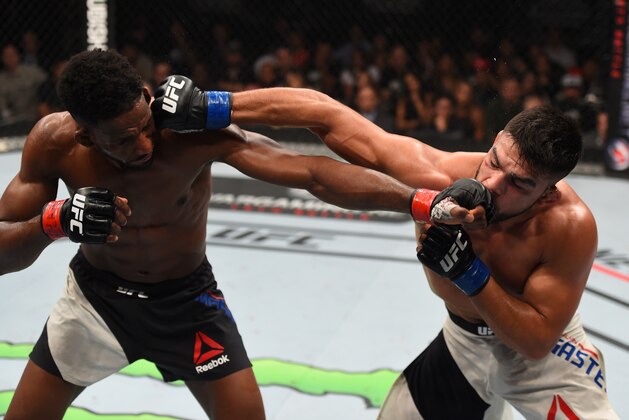 MONTERREY, MEXICO - NOVEMBER 21:  (L-R) Neil Magny of the United States and Kelvin Gastelum of the United States trade punches in their welterweight bout during the UFC Fight Night event at Arena Monterrey on November 21, 2015 in Monterrey, Mexico.  (Photo by Jeff Bottari/Zuffa LLC/Zuffa LLC via Getty Images)