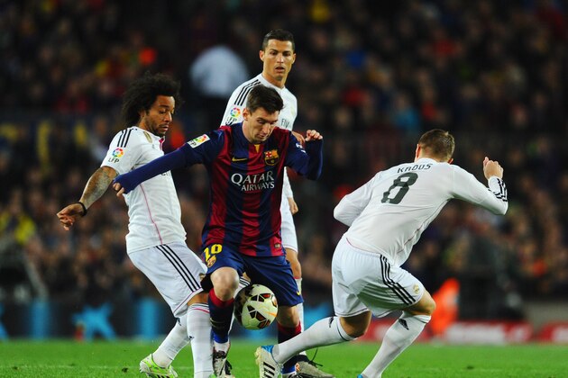 BARCELONA, SPAIN - MARCH 22: Lionel Messi of Barcelona takes on Marcelo (L), Cristiano Ronaldo (2R) and Toni Kroos of Real Madrid CF (R) during the La Liga match between FC Barcelona and Real Madrid CF at Camp Nou on March 22, 2015 in Barcelona, Spain. (Photo by David Ramos/Getty Images) BARCELONA, SPAIN - MARCH 22: Lionel Messi of Barcelona takes on Marcelo (L), Cristiano Ronaldo (2R) and Toni Kroos of Real Madrid CF (R) during the La Liga match between FC Barcelona and Real Madrid CF at Camp Nou on March 22, 2015 in Barcelona, Spain. (Photo by David Ramos/Getty Images)