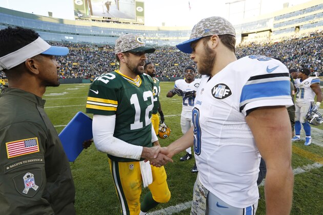 Green Bay Packers' Aaron Rodgers talks to Detroit Lions' Matthew Stafford after an NFL football game Sunday, Nov. 15, 2015, in Green Bay, Wis. The Lions won 18-16. (AP Photo/Mike Roemer)