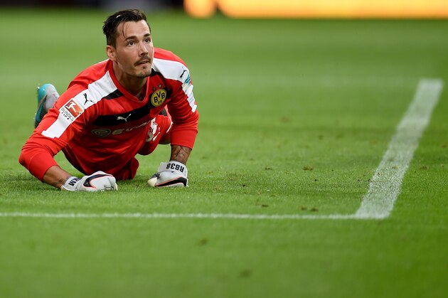 Dortmund's Swiss goalkeeper Roman Buerki reacts during the German first division Bundesliga football match Borussia Dortmund vs Borussia Moenchengladbach in Dortmund, western Germany, on August 15, 2015.  AFP PHOTO / PATRIK STOLLARZ

RESTRICTIONS: DURING MATCH TIME: DFL RULES TO LIMIT THE ONLINE USAGE TO 15 PICTURES PER MATCH AND FORBID IMAGE SEQUENCES TO SIMULATE VIDEO. 
== RESTRICTED TO EDITORIAL USE ==
FOR FURTHER QUERIES PLEASE CONTACT DFL DIRECTLY AT + 49 69 650050.        (Photo credit should read PATRIK STOLLARZ/AFP/Getty Images)
