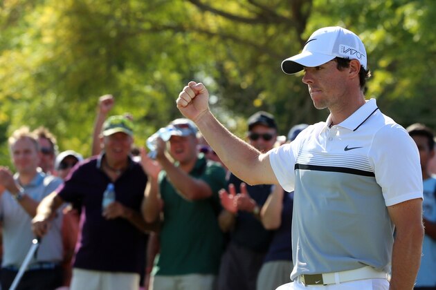 Rory McIlroy of Northern Ireland celebrates his putt during the last day of the DP World Tour Golf Championship in Dubai, on November 22, 2015. The $8 million DP World Tour Championship features the top-60 players in the Race to Dubai. AFP PHOTO / KARIM SAHIB        (Photo credit should read KARIM SAHIB/AFP/Getty Images)