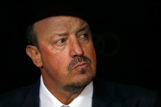Real Madrid's head coach Rafael Benitez waits for the start of the first clasico of the season between Real Madrid and Barcelona at the Santiago Bernabeu stadium in Madrid, Spain, Saturday, Nov. 21, 2015. (AP Photo/Daniel Ochoa de Olza)