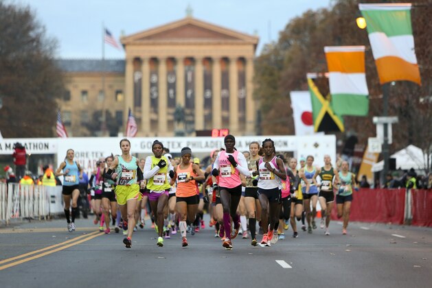Runners make their way down Benjamin Franklin Parkway during the Philadelphia Marathon, Sunday Nov. 23, 2014, in Philadelphia.  (AP Photo/ Joseph Kaczmarek)