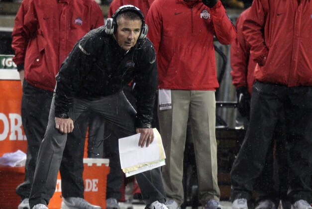 Ohio State head coach Urban Meyer watches from the sidelines against during the second quarter of an NCAA college football game against Ohio State, Saturday, Nov. 21, 2015, in Columbus, Ohio. Michigan State won 17-14. (AP Photo/Jay LaPrete)