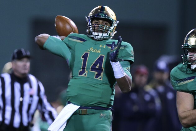 Notre Dame quarterback DeShone Kizer (14) throws during the first half of the Shamrock Series NCAA college football game at Fenway Park, home of the Boston Red Sox, in Boston Saturday, Nov. 21, 2015. (AP Photo/Charles Krupa)