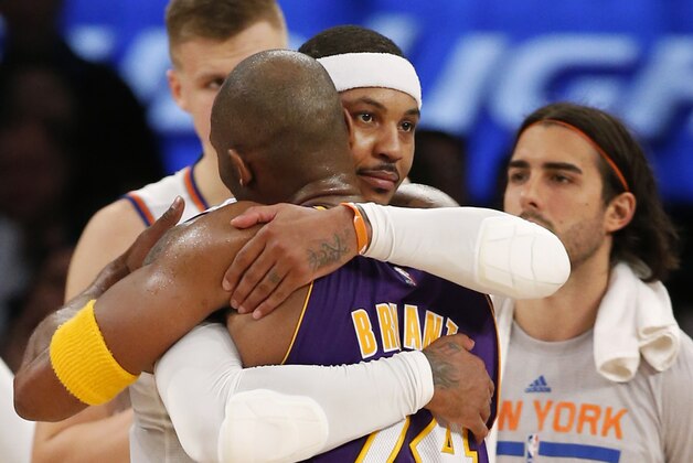 New York Knicks forward Carmelo Anthony (7) embraces Los Angeles Lakers forward Kobe Bryant (24) at the end of an NBA basketball game at Madison Square Garden in New York, Sunday, Nov. 8, 2015. The Knicks defeated the Lakers 99-95. (AP Photo/Kathy Willens)