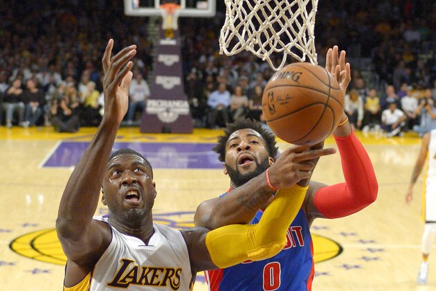 Los Angeles Lakers center Roy Hibbert, left, and Detroit Pistons center Andre Drummond reach for a rebound during the first half of an NBA basketball game, Sunday, Nov. 15, 2015, in Los Angeles. (AP Photo/Mark J. Terrill)