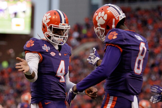 CLEMSON, SC - NOVEMBER 21: Deshaun Watson #4 of the Clemson Tigers celebrates with Deon Cain #8 after a touchdown during their game against the Wake Forest Demon Deacons at Memorial Stadium on November 21, 2015 in Clemson, South Carolina. (Photo by Tyler Smith/Getty Images)