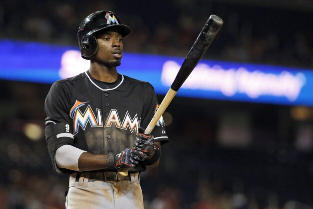 Miami Marlins second baseman Dee Gordon (9) pauses while batting during a baseball game against the Washington Nationals at Nationals Park, Thursday, Sept. 17, 2015, in Washington. The Marlins won 6-4. (AP Photo/Alex Brandon)