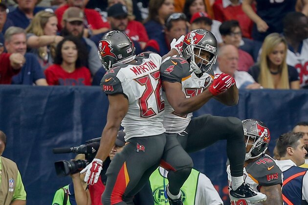 HOUSTON, TX - SEPTEMBER 27:  Doug Martin #22 of the Tampa Bay Buccaneers and Charles Sims #34 celebrate after a score against the Houston Texans at NRG Stadium on September 27, 2015 in Houston, Texas.  (Photo by Bob Levey/Getty Images)