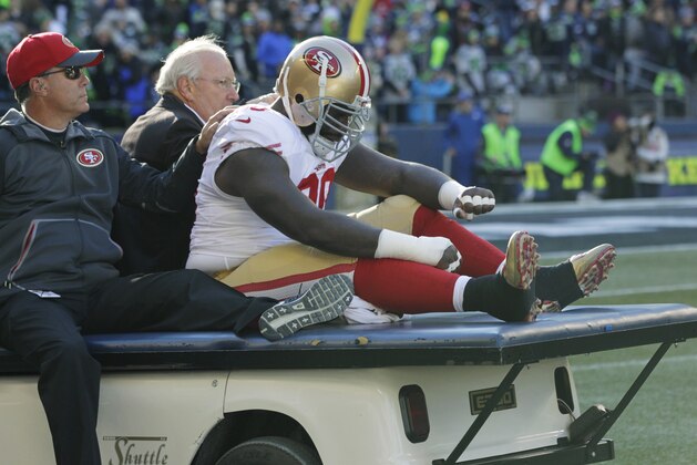 Injured San Francisco 49ers defensive end Glenn Dorsey is taken off the field on a cart after he was hurt during the first half of an NFL football game against the Seattle Seahawks, Sunday, Nov. 22, 2015, in Seattle. (AP Photo/John Froschauer)