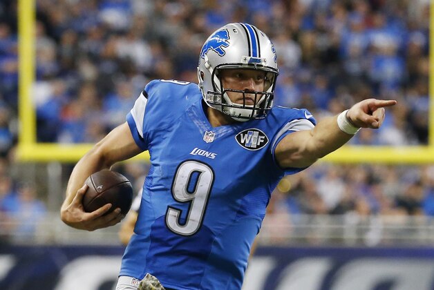 Detroit Lions quarterback Matthew Stafford (9) points as he scrambles during the second half of an NFL football game against the Oakland Raiders, Sunday, Nov. 22, 2015, in Detroit. (AP Photo/Paul Sancya)