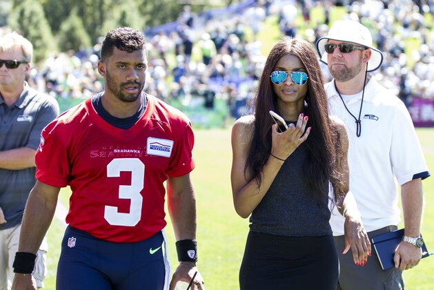 Seattle Seahawks quarterback Russell Wilson and girlfriend Ciara during an NFL football training camp on Friday, July 31, 2015, in Renton, Wash. (AP Photo/Stephen Brashear)