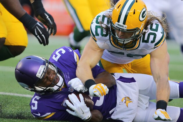 MINNEAPOLIS, MN - NOVEMBER 22:  Teddy Bridgewater #5 of the Minnesota Vikings advances the ball against Clay Matthews #52 of the Green Bay Packers in the second quarter on November 22, 2015 at TCF Bank Stadium in Minneapolis, Minnesota. (Photo by Adam Bettcher/Getty Images)