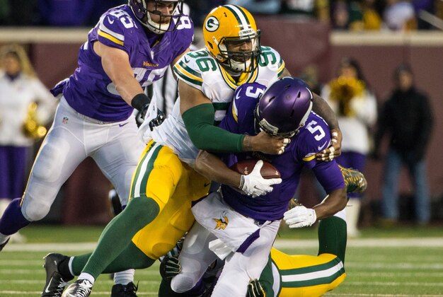 Nov 22, 2015; Minneapolis, MN, USA; Minnesota Vikings quarterback Teddy Bridgewater (5) is sacked by Green Bay Packers linebacker Mike Neal (96) during the second quarter at TCF Bank Stadium. Mandatory Credit: Brace Hemmelgarn-USA TODAY Sports