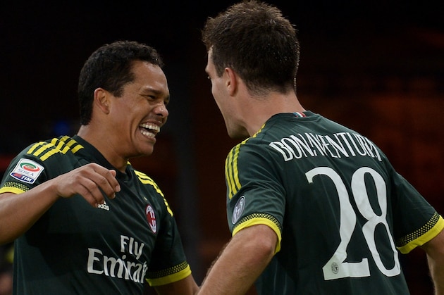 AC Milan's forward from Colombia Carlos Bacca (L) celebrates with teammate AC Milan's midfielder from Italy Giacomo Bonaventura after scoring during the Italian Serie A football match between Lazio and AC Milan at Olympic Stadium in Rome on November 1, 2015. AFP PHOTO / TIZIANA FABI        (Photo credit should read TIZIANA FABI/AFP/Getty Images)