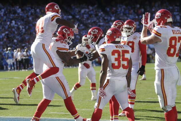 The Kansas City Chiefs' Dontari Poe, below, celebrates his touchdown during the first half of an NFL football game against the San Diego Chargers Sunday, Nov. 22, 2015, in San Diego. (AP Photo/Lenny Ignelzi)