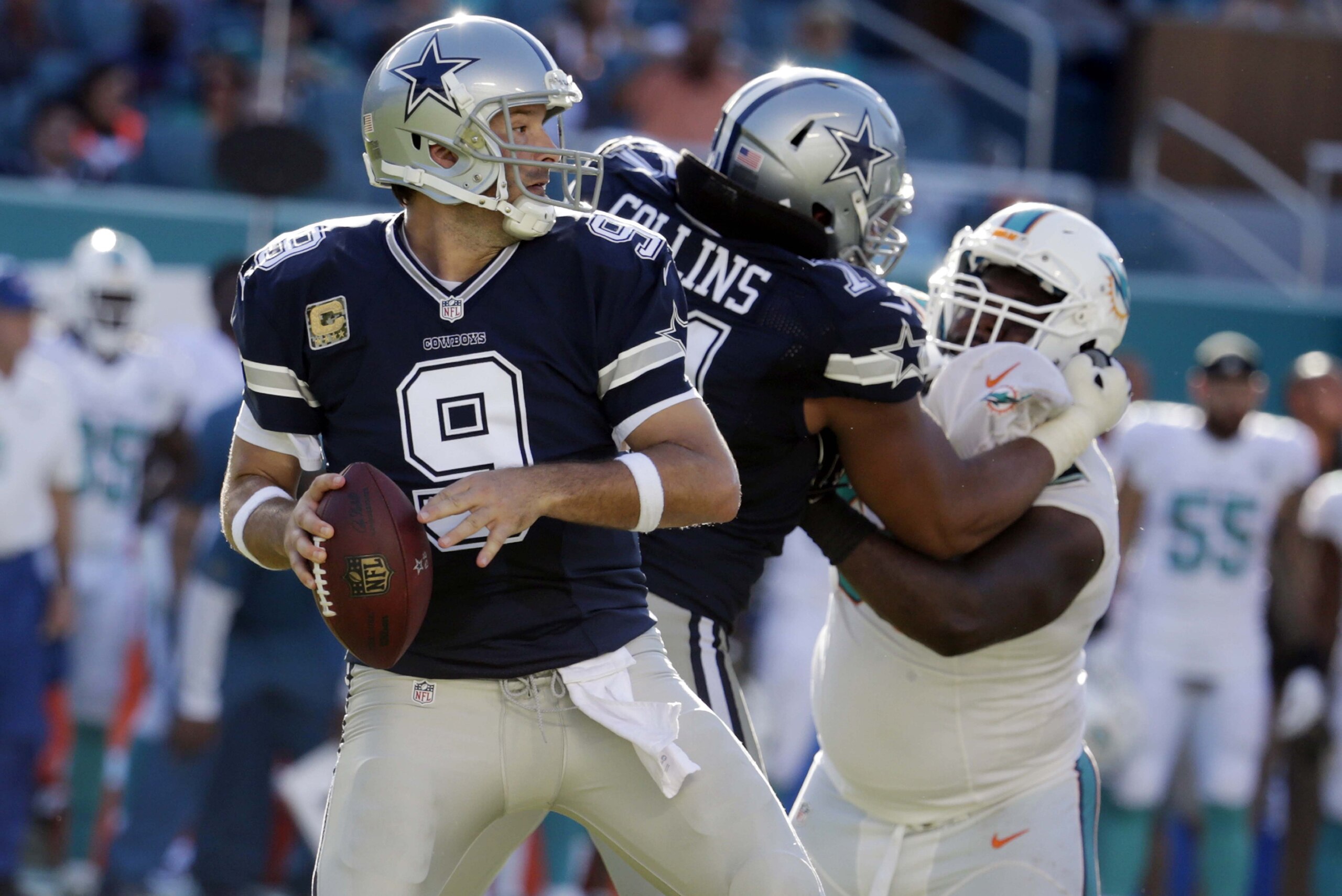 Dallas Cowboys quarterback Tony Romo (9) looks to pass during the second half of an NFL football game against the Miami Dolphins, Sunday, Nov. 22, 2015, in Miami Gardens, Fla.  (AP Photo/Lynne Sladky)