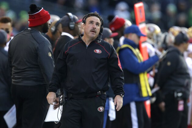 San Francisco 49ers head coach Jim Tomsula looks to the scoreboard in the first half of an NFL football game against the Seattle Seahawks, Sunday, Nov. 22, 2015, in Seattle. (AP Photo/John Froschauer)