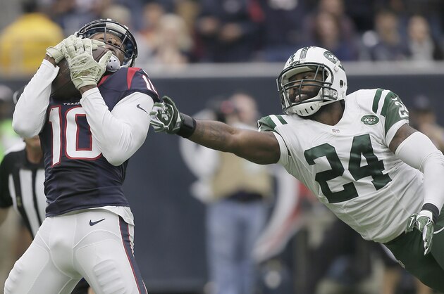 HOUSTON, TX - NOVEMBER 22: DeAndre Hopkins #10 of the Houston Texans catches a touchdown pass against the Darrelle Revis #24 of the New York Jets in the second quarter on November 22, 2015 at NRG Stadium in Houston, Texas. (Photo by Bob Levey/Getty Images)
