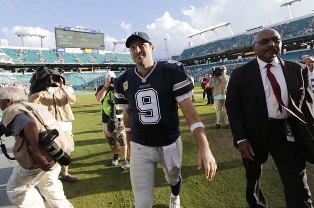 Dallas Cowboys quarterback Tony Romo (9) leaves the field at the end of an NFL football game against the Miami Dolphins, Sunday, Nov. 22, 2015, in Miami Gardens, Fla. The Cowboys defeated the Dolphins 24-14.  (AP Photo/Lynne Sladky)