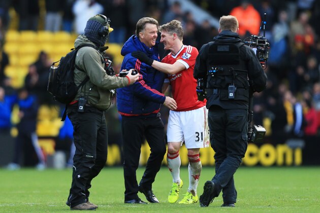WATFORD, ENGLAND - NOVEMBER 21: Manager Louis van Gaal (2nd L) and Bastian Schweinsteiger (2nd R) of Manchester United celebrate their 2-1 win in the Barclays Premier League match between Watford and Manchester United at Vicarage Road on November 21, 2015 in Watford, England.  (Photo by Stephen Pond/Getty Images)