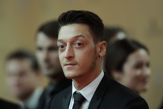 German soccer player Mesut Oezil arrives for the Bambi 2015 media awards in Berlin, Thursday, Nov. 12, 2015. (AP Photo/Markus Schreiber)