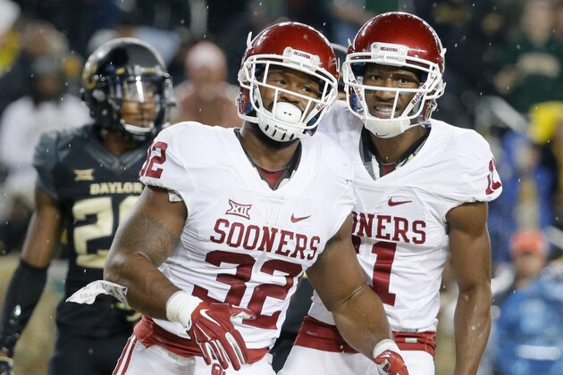 Oklahoma running back Samaje Perine (32) and Dede Westbrook (11) celebrate Perine's touchdown in the first half of an NCAA college football game against Baylor on Saturday, Nov. 14, 2015, in Waco, Texas. (AP Photo/Tony Gutierrez)