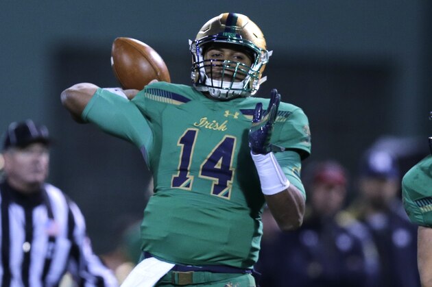 Notre Dame quarterback DeShone Kizer (14) throws during the first half of the Shamrock Series NCAA college football game at Fenway Park, home of the Boston Red Sox, in Boston Saturday, Nov. 21, 2015. (AP Photo/Charles Krupa)