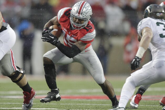 Ohio State running back Ezekiel Elliott (15) runs the ball against Michigan State during the first quarter of an NCAA college football game Saturday, Nov. 21, 2015, in Columbus, Ohio. Michigan State beat Ohio State 17-14. (AP Photo/Jay LaPrete)
