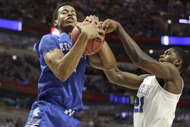 Kentucky forward Skal Labissiere, left, battles Duke forward Amile Jefferson (21) for a rebound during the first half of an NCAA basketball game, Tuesday, Nov. 17, 2015, in Chicago. (AP Photo/Nam Y. Huh)