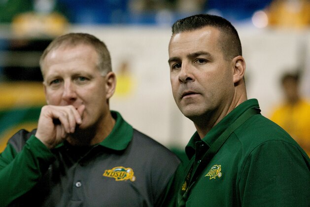 North Dakota State athletic director Matt Larsen, right and NDSU head football coach Chris Klieman confer before  an NCAA college football game against South Dakota Saturday, Oct. 17, 2015, in Fargo, N.D. (AP Photo/Bruce Crummy)