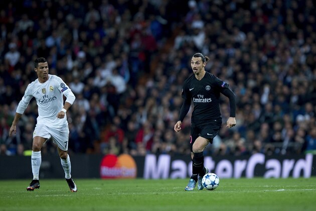 MADRID, SPAIN - NOVEMBER 03: Zlatan Ibrahimovic (R) of Paris Saint-Germain controls the ball ahead Cristiano Ronaldo (L) of Real Madrid CF during the UEFA Champions League Group A match between Real Madrid CF and Paris Saint-Germain at Estadio Santiago Bernabeu on November 3, 2015 in Madrid, Spain. (Photo by Gonzalo Arroyo Moreno/Getty Images) MADRID, SPAIN - NOVEMBER 03: Zlatan Ibrahimovic (R) of Paris Saint-Germain controls the ball ahead Cristiano Ronaldo (L) of Real Madrid CF during the UEFA Champions League Group A match between Real Madrid CF and Paris Saint-Germain at Estadio Santiago Bernabeu on November 3, 2015 in Madrid, Spain. (Photo by Gonzalo Arroyo Moreno/Getty Images)