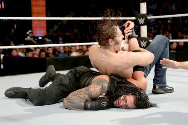 Dean Ambrose and Roman Reigns clash for the vacant WWE World Heavyweight Championship. Dean Ambrose and Roman Reigns clash for the vacant WWE World Heavyweight Championship.