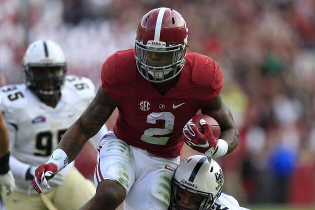 Nov 21, 2015; Tuscaloosa, AL, USA; Alabama Crimson Tide running back Derrick Henry (2) is hit by Charleston Southern Buccaneers linebacker Zack Johnson (22) as he goes for a score at Bryant-Denny Stadium. Mandatory Credit: Marvin Gentry-USA TODAY Sports