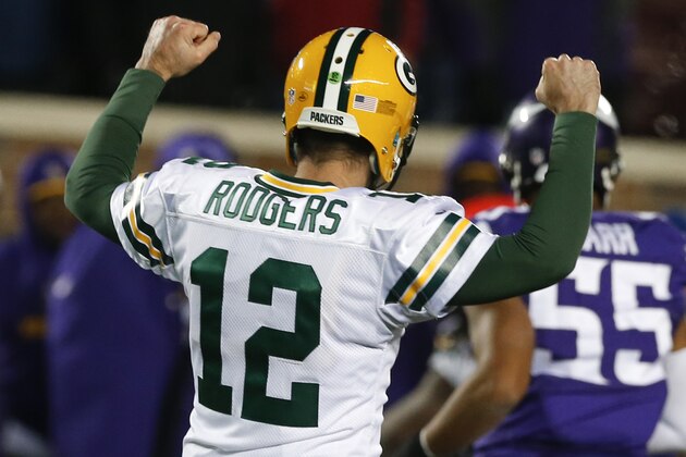 Green Bay Packers quarterback Aaron Rodgers (12) celebrates first down against the Minnesota Vikings during the second half of an NFL football game in Minneapolis, Sunday, Nov. 22, 2015. The Packers defeated the Vikings 30-13. (AP Photo/Jim Mone)