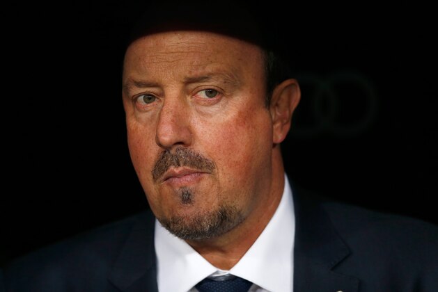 Real Madrid's head coach Rafael Benitez waits for the start of the first clasico of the season between Real Madrid and Barcelona at the Santiago Bernabeu stadium in Madrid, Spain, Saturday, Nov. 21, 2015. (AP Photo/Daniel Ochoa de Olza)