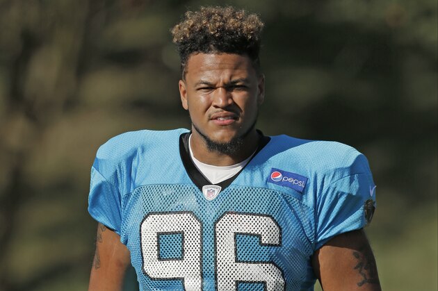 Carolina Panthers' Wes Horton (96) arrives for practice during the NFL football team's training camp in Spartanburg, S.C., Sunday, Aug. 2, 2015. (AP Photo/Chuck Burton)