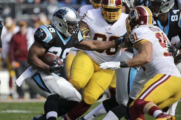 Carolina Panthers' Jonathan Stewart (28) runs against the Washington Redskins in the first half of an NFL football game in Charlotte, N.C., Sunday, Nov. 22, 2015. (AP Photo/Chuck Burton)