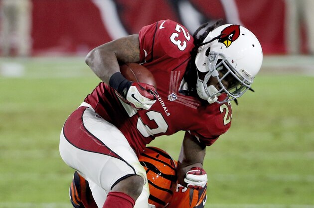 Arizona Cardinals running back Chris Johnson (23) is hit by Cincinnati Bengals outside linebacker Vontaze Burfict (55) during the second half of an NFL football game, Sunday, Nov. 22, 2015, in Glendale, Ariz. (AP Photo/Ross D. Franklin)