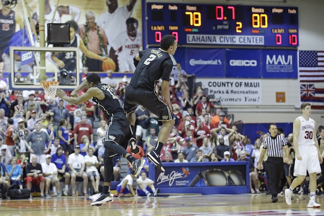 Wake Forest's Bryant Crawford (13) and Devin Thomas (2) celebrate in the final seconds of the second half of an NCAA college basketball game against Indiana in the first round of the Maui Invitational, Monday, Nov. 23, 2015, in Lahaina, Hawaii. Wake Forest won 82-78. (AP Photo/Rick Bowmer)