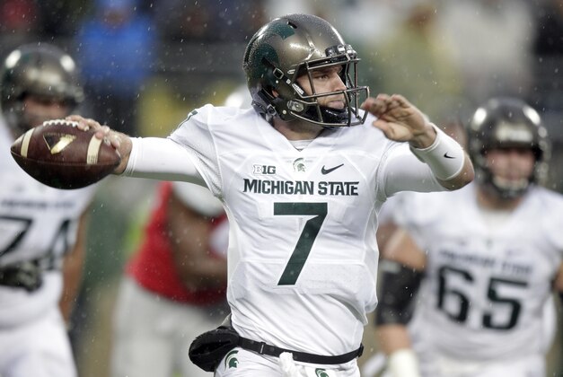 Michigan State quarterback Tyler O'Connor throws a pass against Ohio State during the second quarter of an NCAA college football game, Saturday, Nov. 21, 2015, in Columbus, Ohio. (AP Photo/Jay LaPrete)