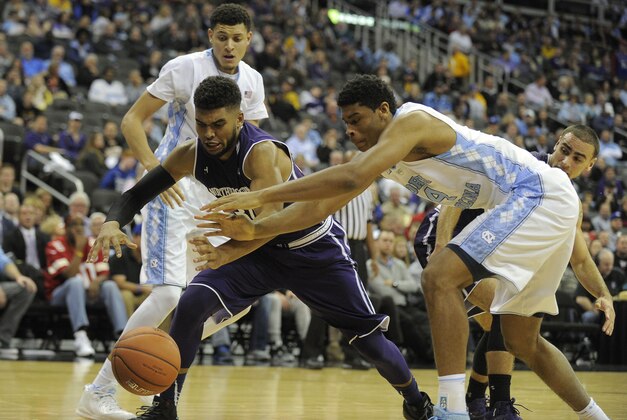 Nov 23, 2015; Kansas City, MO, USA; Northwestern Wildcats guard Sanjay Lumpkin (34) and North Carolina Tar Heels forward Isaiah Hicks (4) reach for a loose ball in the first half at Sprint Center. Mandatory Credit: John Rieger-USA TODAY Sports