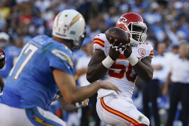 Kansas City Chiefs outside linebacker Justin Houston (50) intercepts a pass thrown by San Diego Chargers quarterback Philip Rivers (17) during the second half of an NFL football game Sunday, Nov. 22, 2015, in San Diego. Houston scored a touchdown on the play. (AP Photo/Lenny Ignelzi)
