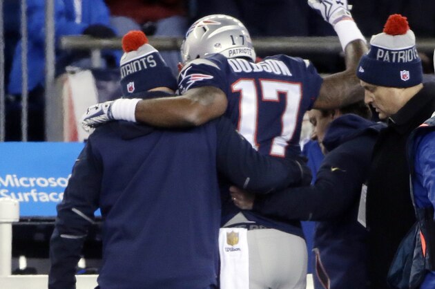 New England Patriots wide receiver Aaron Dobson (17) is helped to the sideline after an injury in the first half of an NFL football game against the Buffalo Bills, Monday, Nov. 23, 2015, in Foxborough, Mass. (AP Photo/Steven Senne)