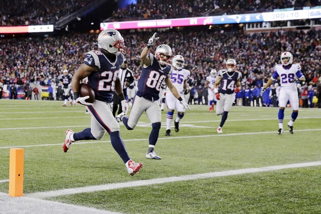 New England Patriots running back James White (28) scores a touchdown as teammate Danny Amendola (80) celebrates in the first half of an NFL football game against the Buffalo Bills, Monday, Nov. 23, 2015, in Foxborough, Mass. (AP Photo/Charles Krupa)
