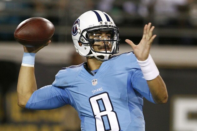 Nov 19, 2015; Jacksonville, FL, USA;  Tennessee Titans quarterback Marcus Mariota (8) drops to throw a pass during the second quarter of a football game against the Jacksonville Jaguars at EverBank Field. Mandatory Credit: Reinhold Matay-USA TODAY Sports