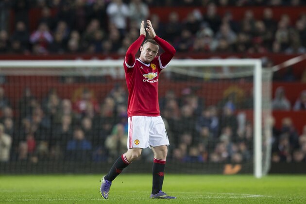 Manchester United's Wayne Rooney applauds supporters after being substituted during the English Premier League soccer match between Manchester United and West Bromwich Albion at Old Trafford Stadium, Manchester, England, Saturday, Nov. 7, 2015. (AP Photo/Jon Super)