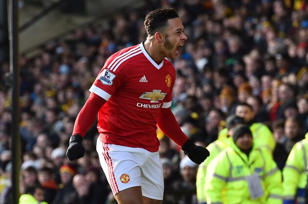 Manchester United's Dutch midfielder Memphis Depay celebrates scoring the opening goal of the English Premier League football match between Watford and Manchester United at Vicarage Road Stadium in Watford, north of London on November 21, 2015. AFP PHOTO / BEN STANSALL

RESTRICTED TO EDITORIAL USE. No use with unauthorized audio, video, data, fixture lists, club/league logos or 'live' services. Online in-match use limited to 75 images, no video emulation. No use in betting, games or single club/league/player publications.        (Photo credit should read BEN STANSALL/AFP/Getty Images)
