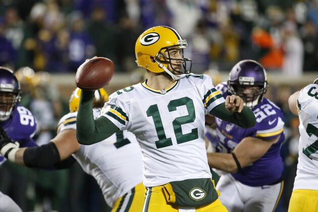 Green Bay Packers quarterback Aaron Rodgers (12) throws against the Minnesota Vikings during the second half of an NFL football game in Minneapolis, Sunday, Nov. 22, 2015. (AP Photo/Ann Heisenfelt)